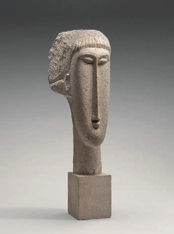 Cabeça de mulher, de Amedeo Modigliani, escultura em calcário de cerca de 1910 a 1911, com rosto alongado e traços simplificados.