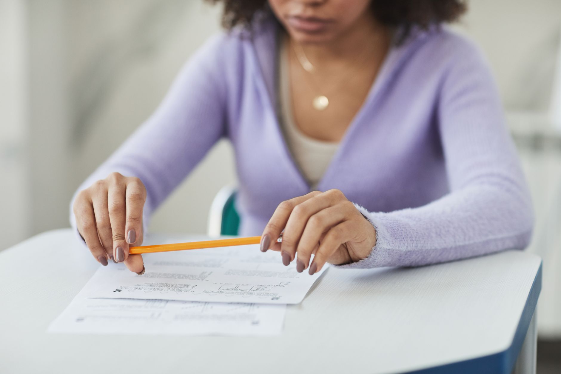 woman holding a pencil